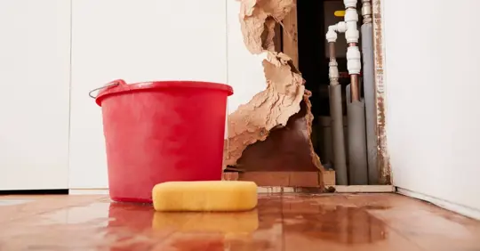 Damaged Wall Exposed Burst Water Pipes Sponge And Bucket